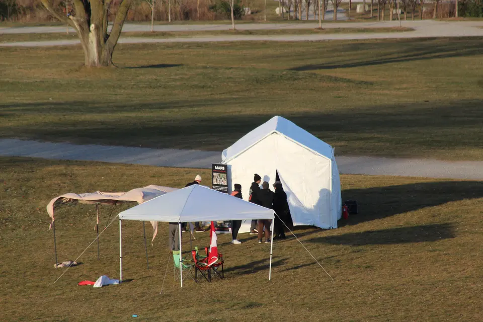 Launch-field shelter and equipment beneath a canopy