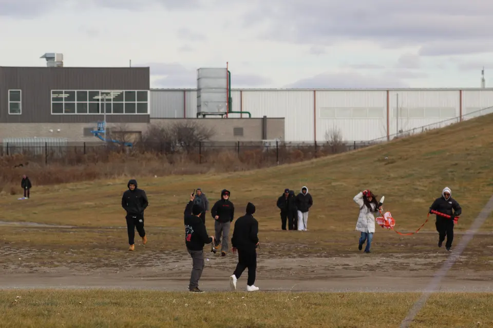 Students crossing the launch field